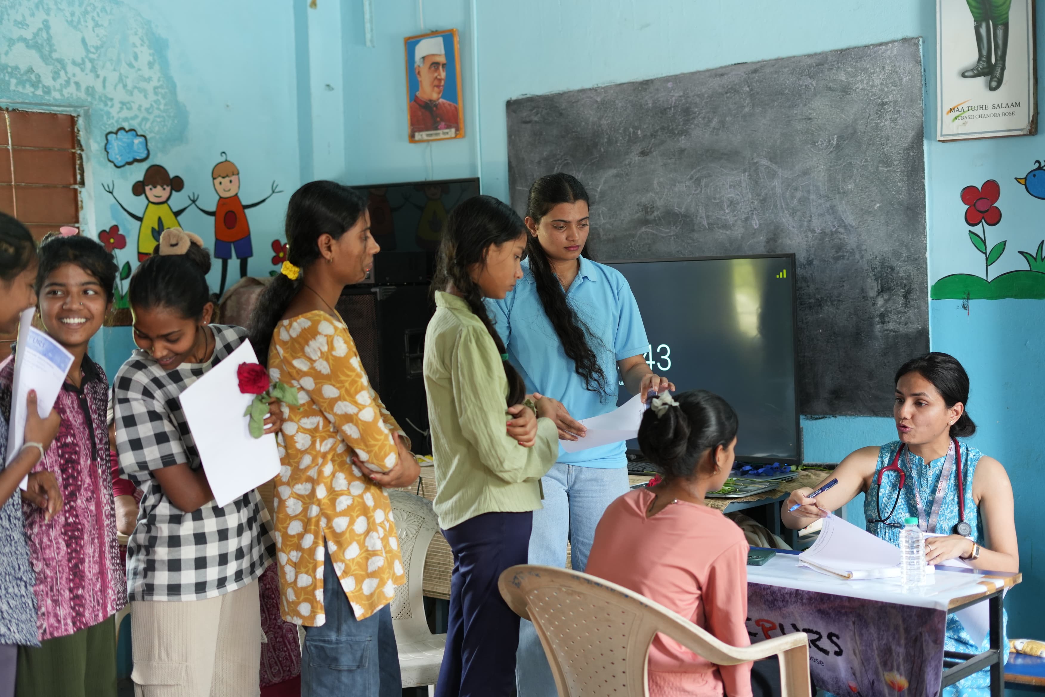 Dr Vaishnavi consulting child patient at camp